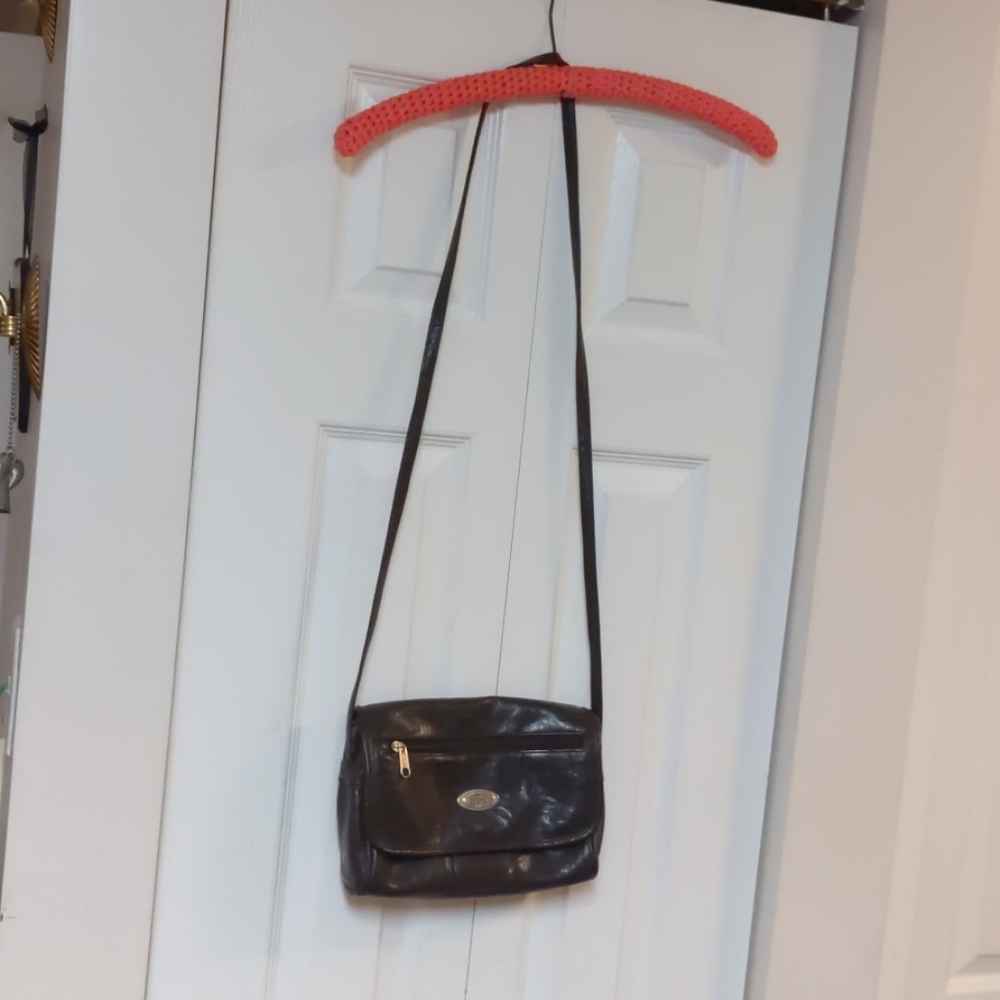 T R BENTLEY dark brown body bag,